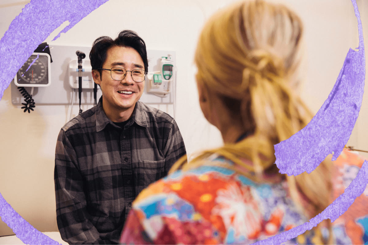 A man in conversation with a nurse